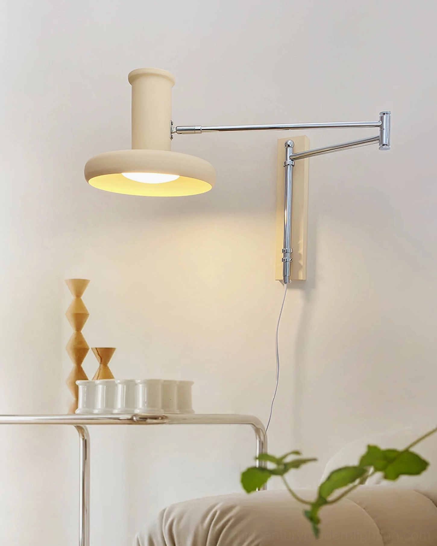 Adjustable swing arm sconce in minimalist bedroom low-angle view, mounted above bedside table in contemporary home styling
