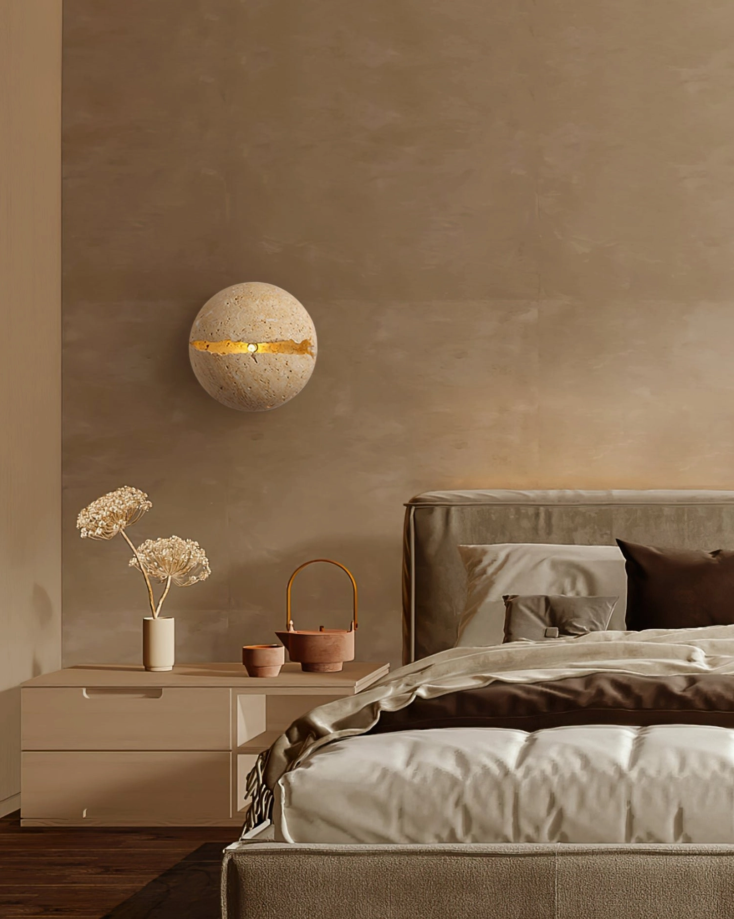 Round beige travertine wall lamp showing authentic natural crack detailing and architectural mounting