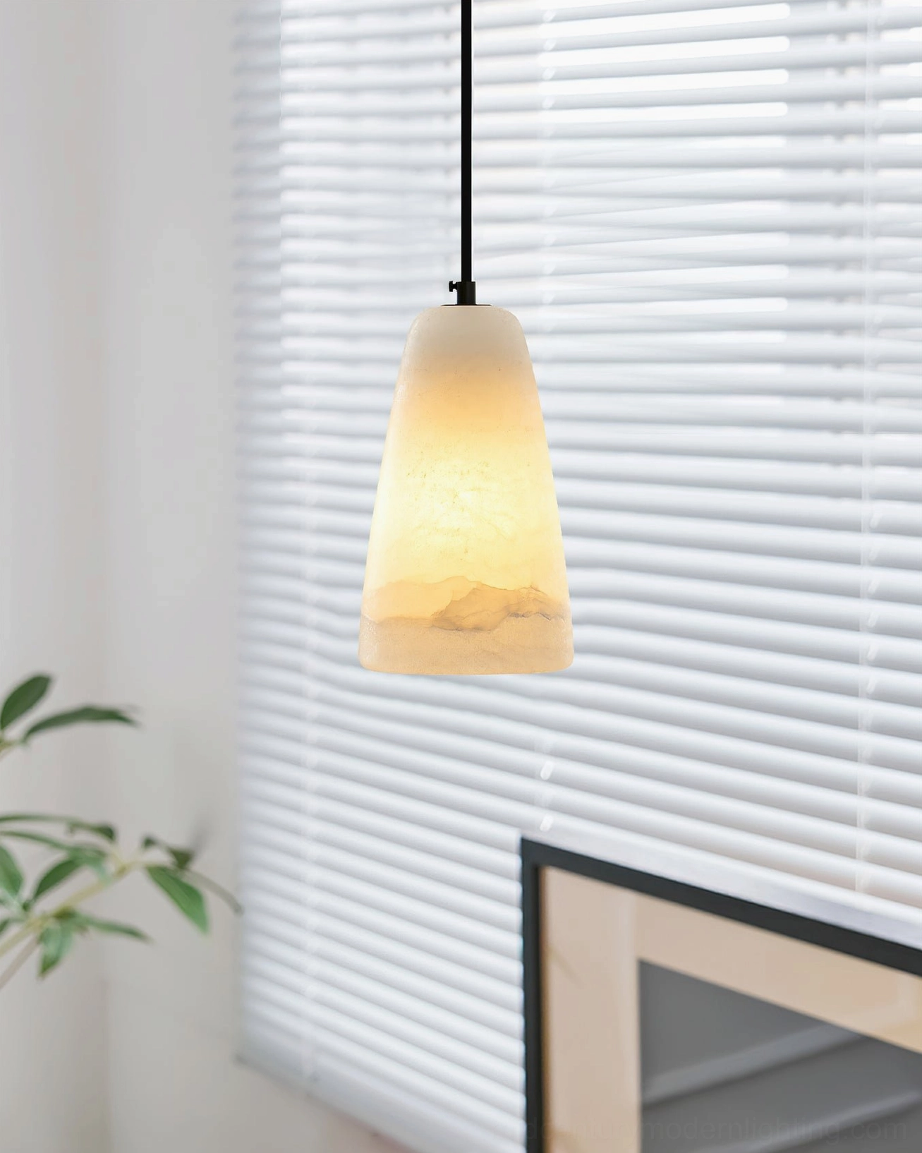 Backlit Belfry alabaster pendant lamp with natural window light highlighting stone texture