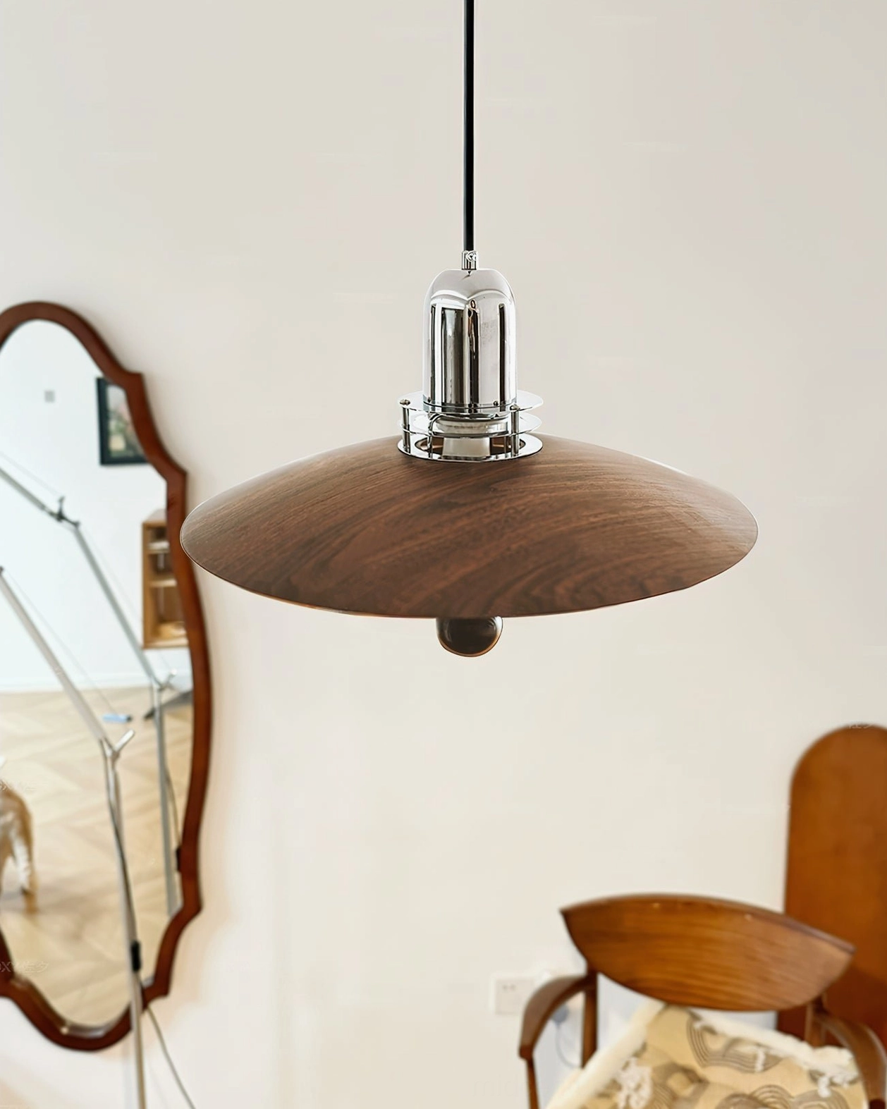 Belid pendant lamp side profile in cozy vintage living corner, solid walnut wood shade with spherical accent