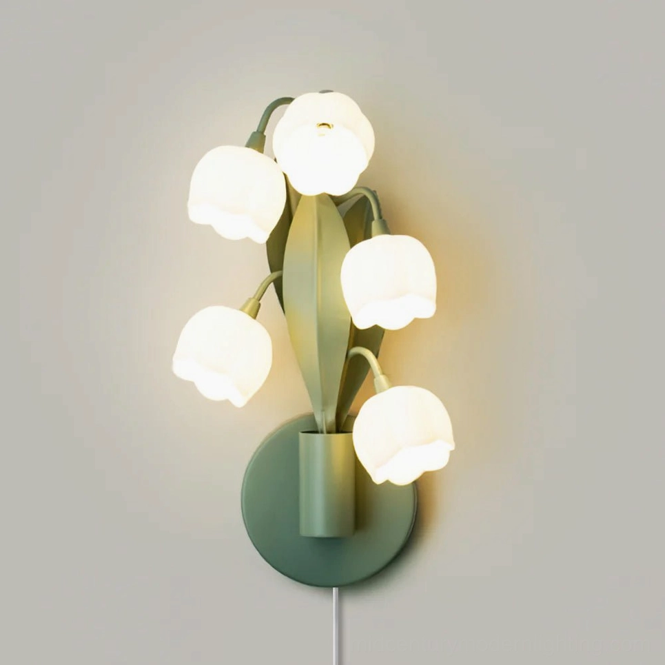 Close-up detail of Bell Orchid wall lamp showing six white bell-shaped lampshades and matte green stem structure