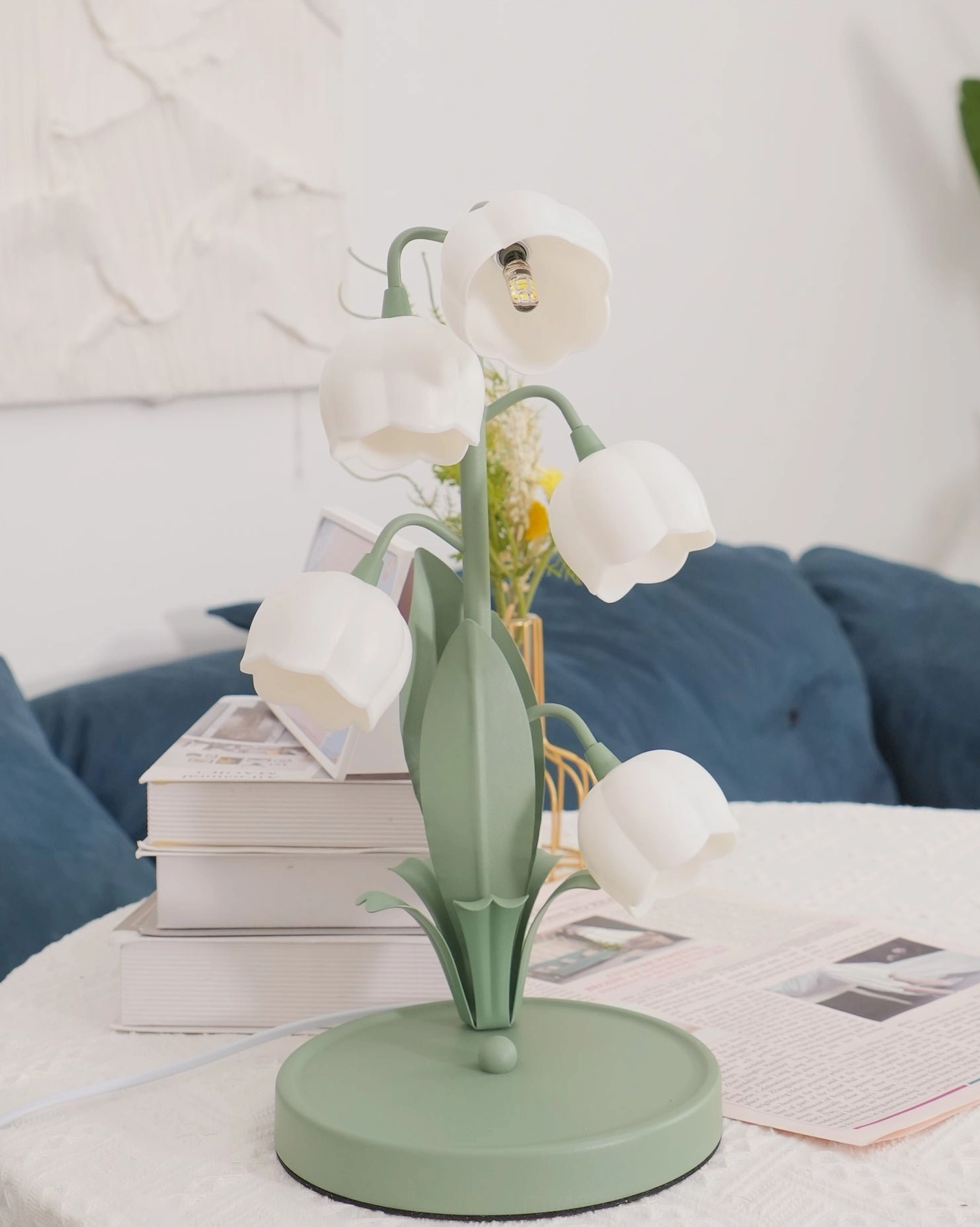 Bell Orchid Table Lamp glowing in dim lighting showing ambient luminescence and shade transparency