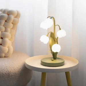 Lit Bell Orchid Table Lamp casting warm glow in modern living room corner with fabric sofa and round side table