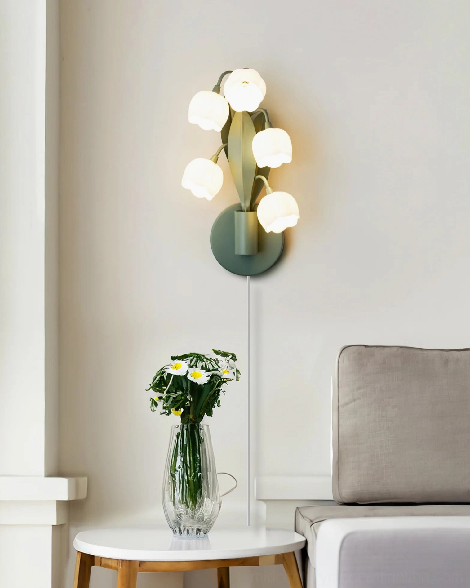Bell Orchid wall lamp creating soft illumination in minimalist living room with side table, modern home setting
