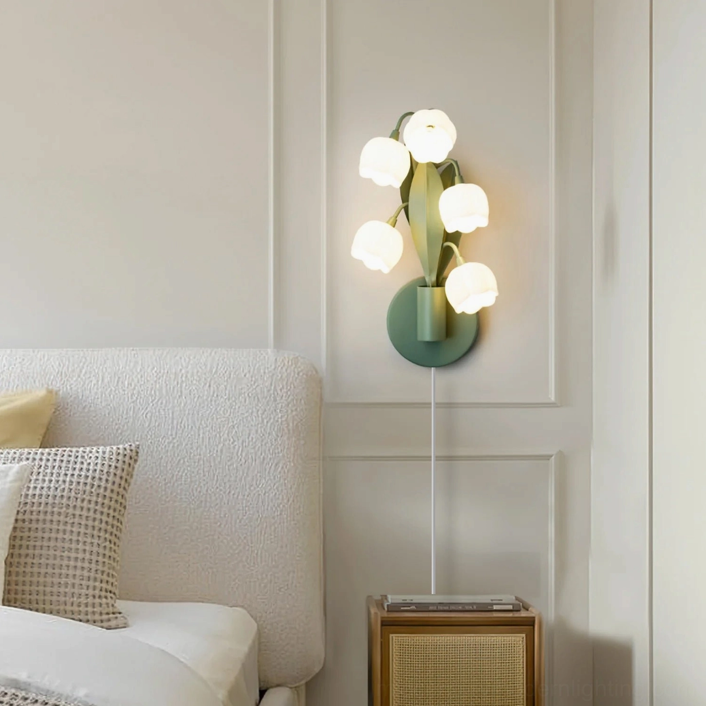 Bell Orchid plug-in wall lamp mounted in Nordic style bedroom beside bed and nightstand, botanical ambient lighting
