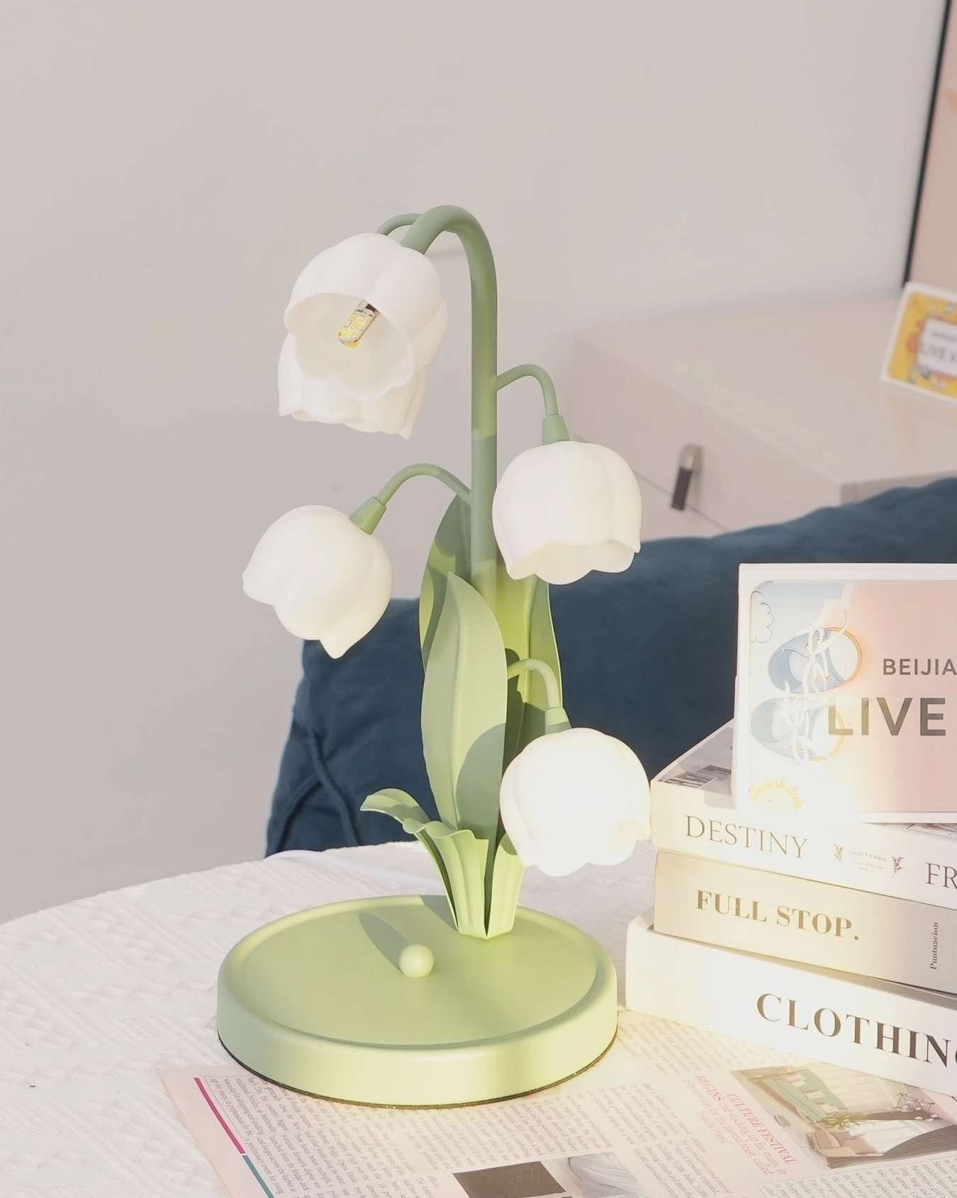 Bell Orchid Table Lamp on side table with decorative accessories and interior design styling