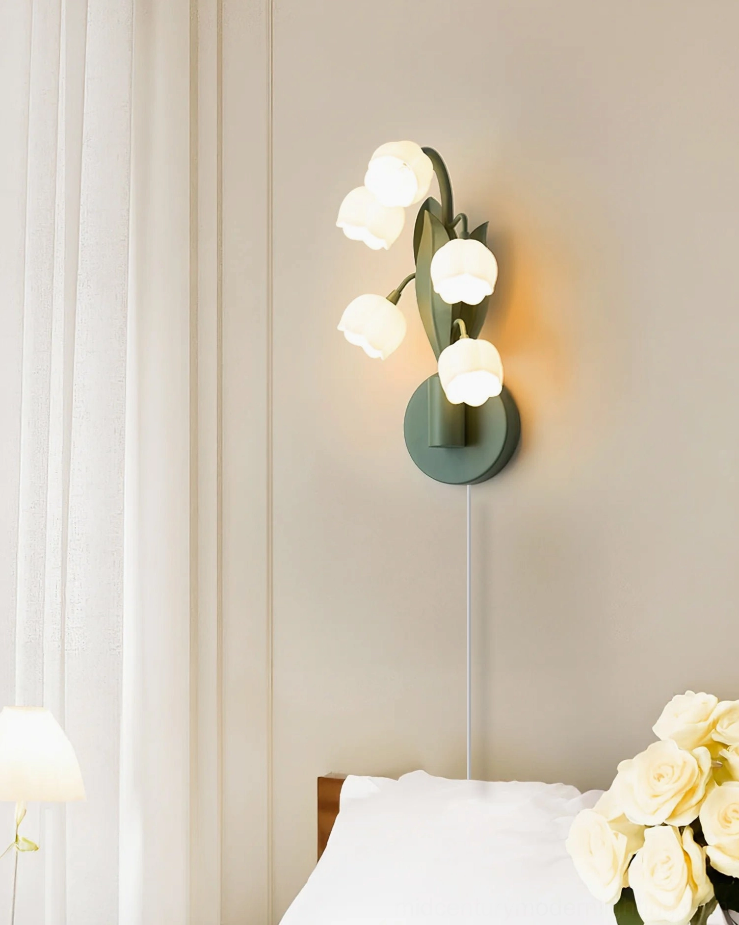 Bell Orchid lamp emitting warm glowing light in bedroom with sheer window curtains, cozy evening ambiance