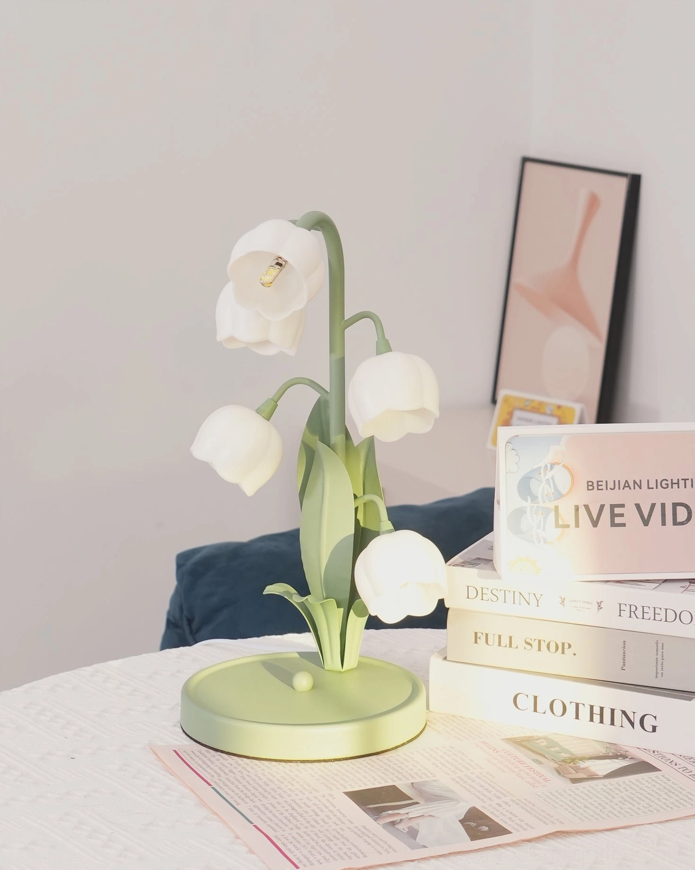 Bell Orchid Table Lamp warm glow casting atmospheric light in bedroom reading corner