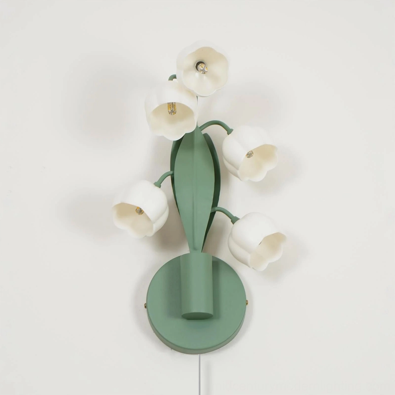 Bell Orchid wall mounted lamp displaying six white bloom heads with matte green stem structure, decorative detail