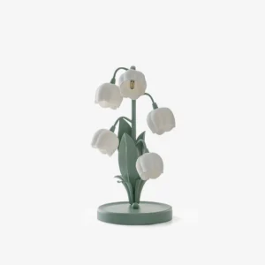 Bell Orchid Table Lamp with sage green metal base and white printed orchid pattern shade, studio front view