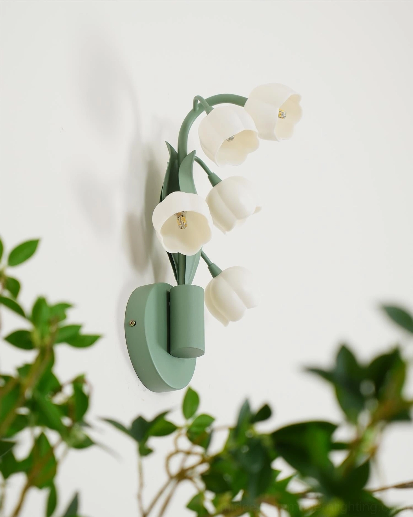 Bell Orchid botanical lamp with five bell-shaped flower buds against soft green foliage background styling