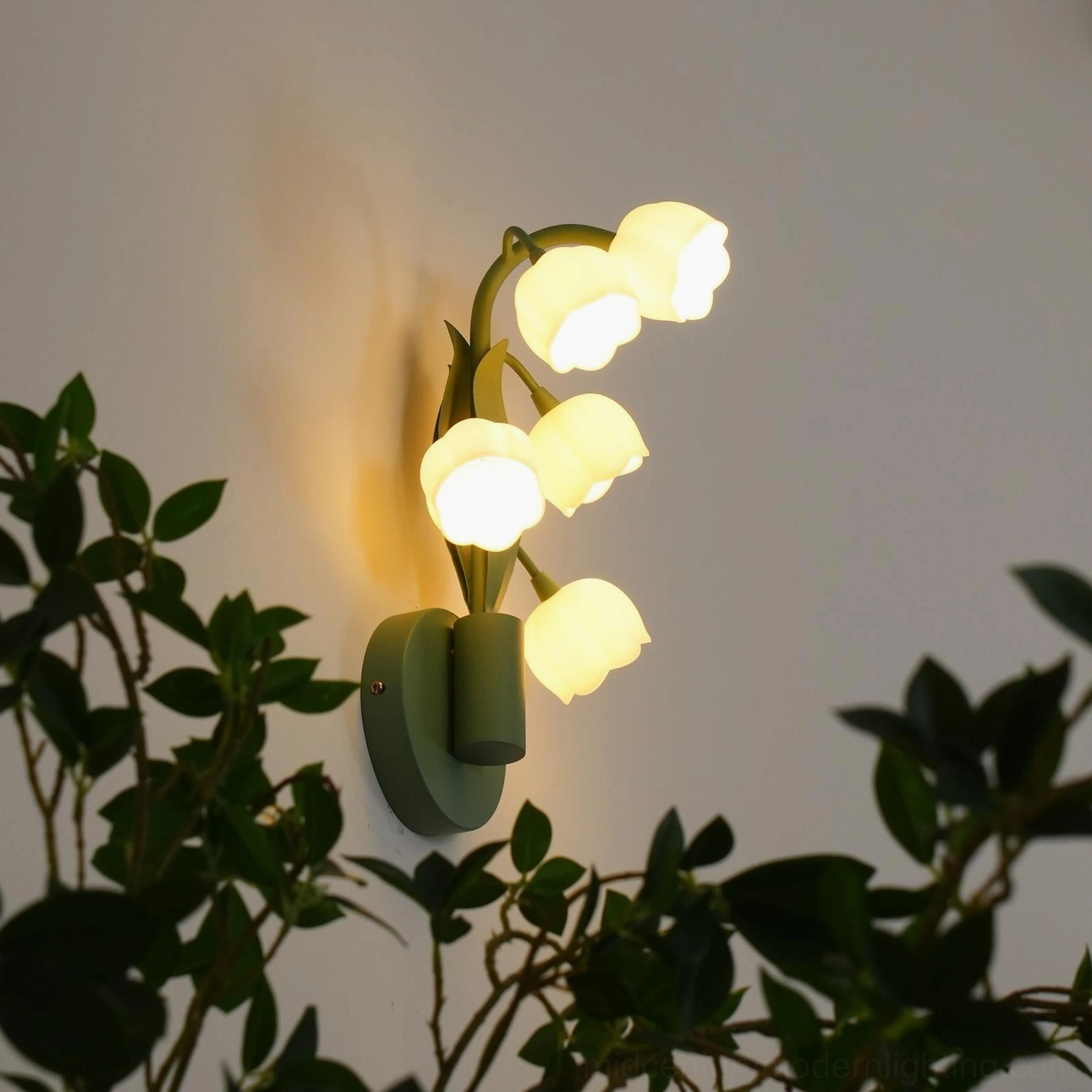 Bell Orchid wall lamp downward lighting effect on white surface showing bell shade light diffusion quality