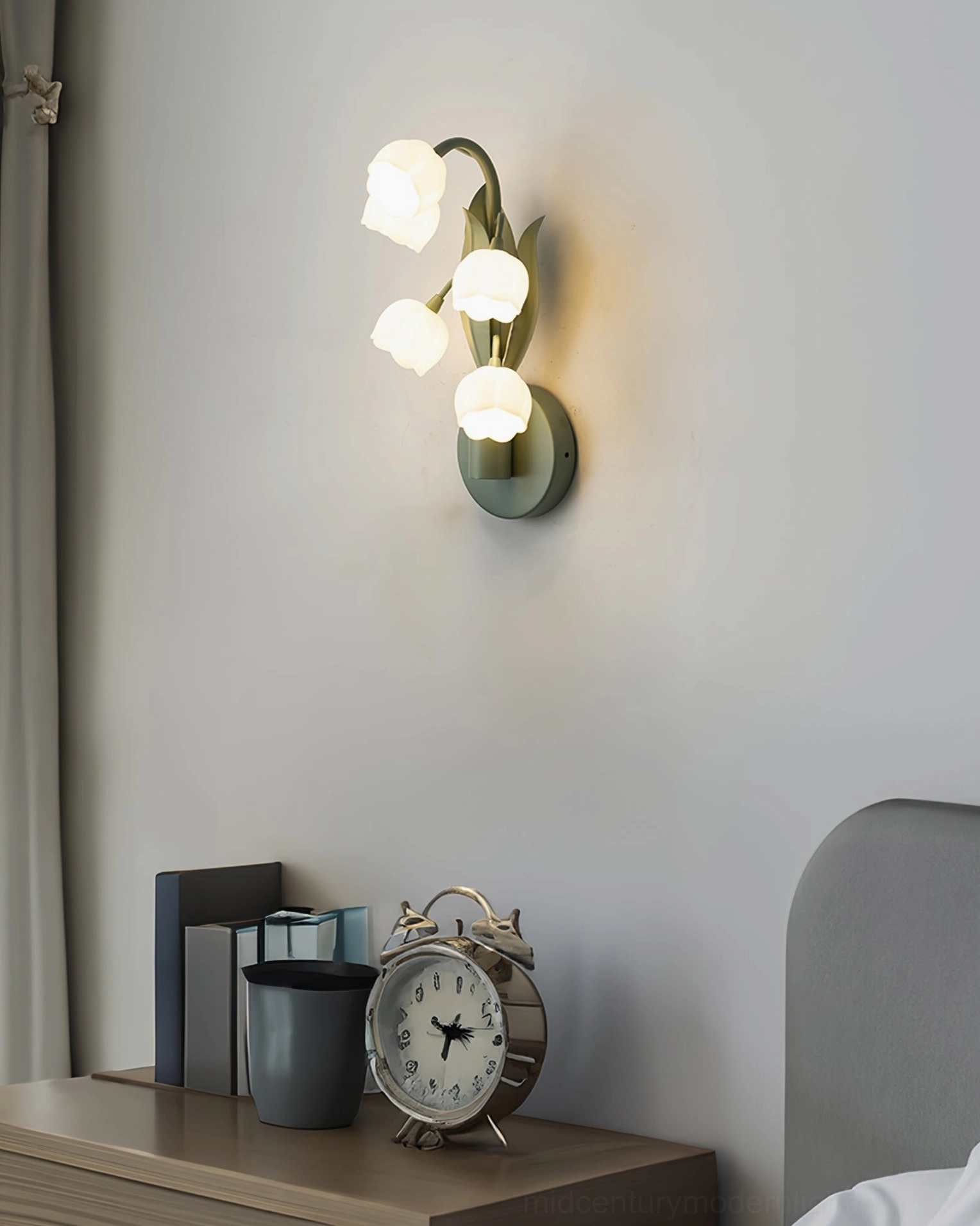 Bell Orchid Lily of the Valley wall lamp paired with artwork and decorative home accessories styling composition