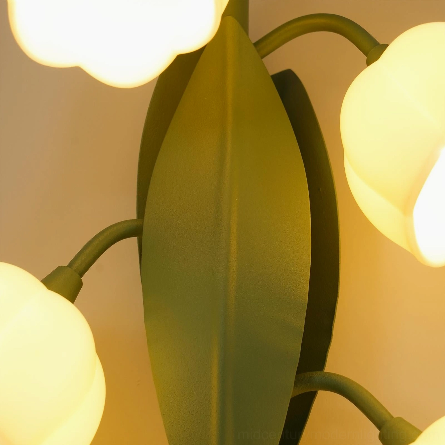 Bell Orchid wall lamp architectural detail showing circular wall plate and vertical stem with leaf elements