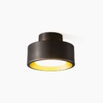 Bella flush mount ceiling light in brass and black metal finish shown front flat view against white background