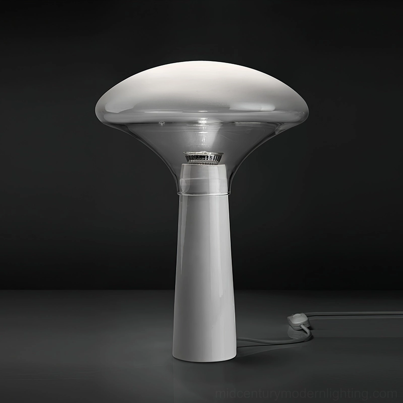 Bella table lamp three-quarter view showing marble base and mouth-blown glass shade detail
