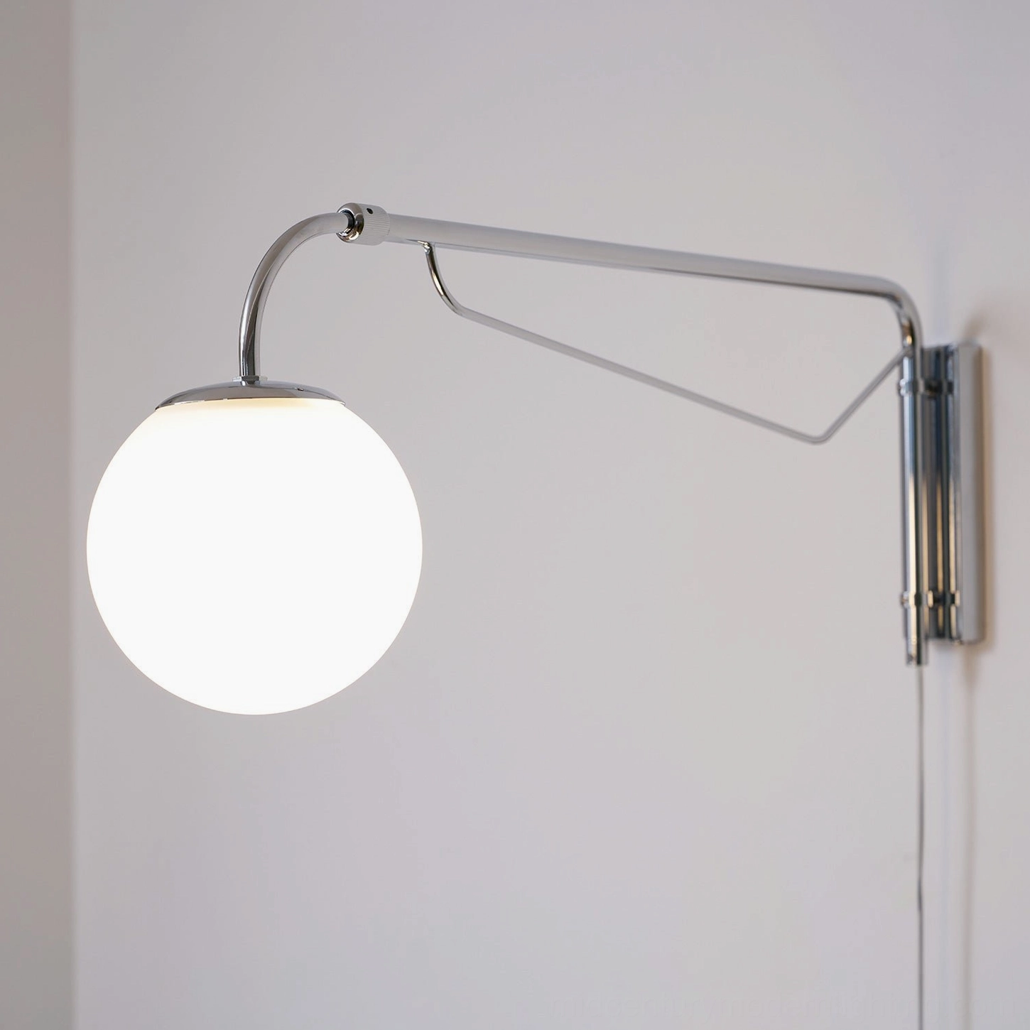 Wall-mounted telescoping lamp mid-century modern design aesthetic