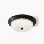 Belmont matte black flush mount ceiling lamp with ribbed frosted glass shade, overhead studio view