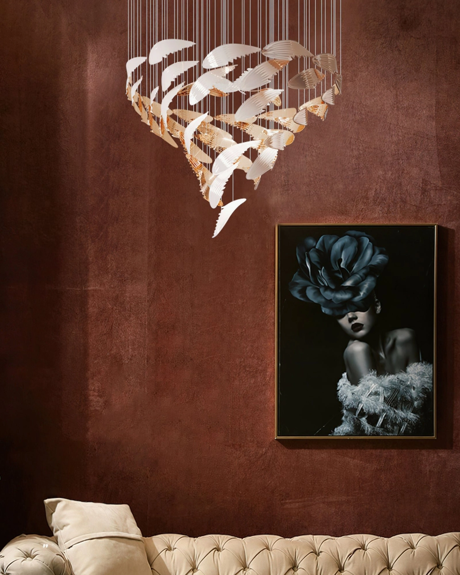 Bennett Wings Chandelier suspended in luxury living room with burgundy accent wall showcasing gold and white finish in residential setting