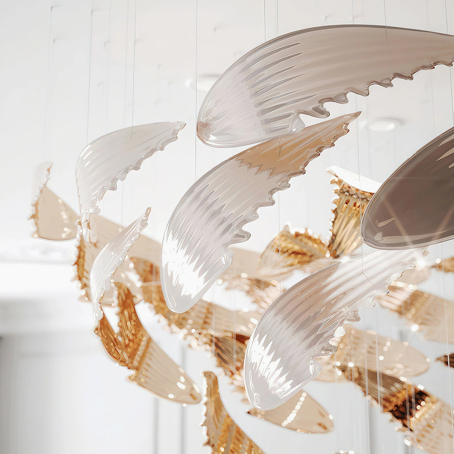 Bennett Wings Chandelier individual wing component macro close-up showing curved feather shape with clear glass and metallic gold surface detail