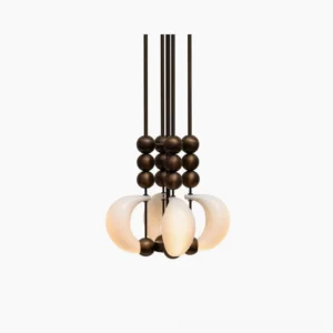 Bent glass pendant light close-up detail showing curved milky white opal glass shade with antique brass spherical accents - modern sculptural chandelier