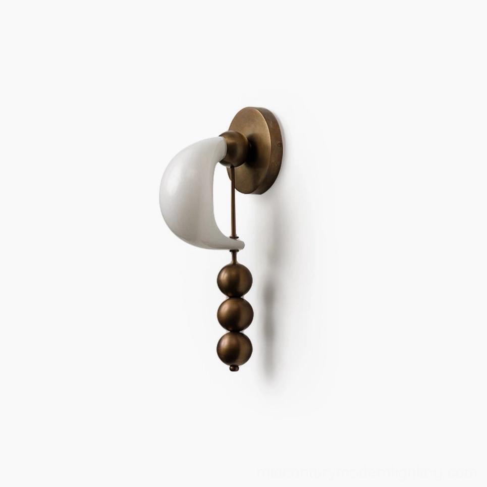 Bent glass wall sconce collection showing multiple finish options including brass, black and white, sculptural design variations