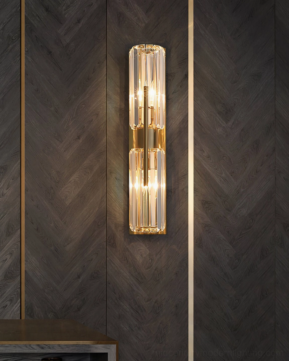 Bepuzz Art Deco Wall Sconce mounted on dark herringbone wood accent wall – luxury brass and crystal design