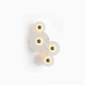 Beran alabaster wall lamp four-head cluster with graduated disc sizes, studio overhead flat lay view showcasing natural stone veining and gold brass fixtures