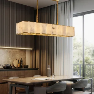 Bernardi alabaster dining chandelier installed in modern kitchen space with warm gold hardware and minimalist luxury aesthetic over counter