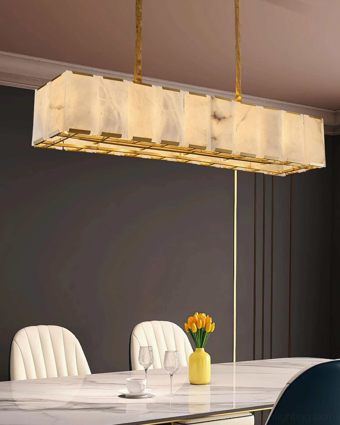 Bernardi alabaster chandelier in small modern dining corner with neutral muted interior and warm ambient lighting from low side angle