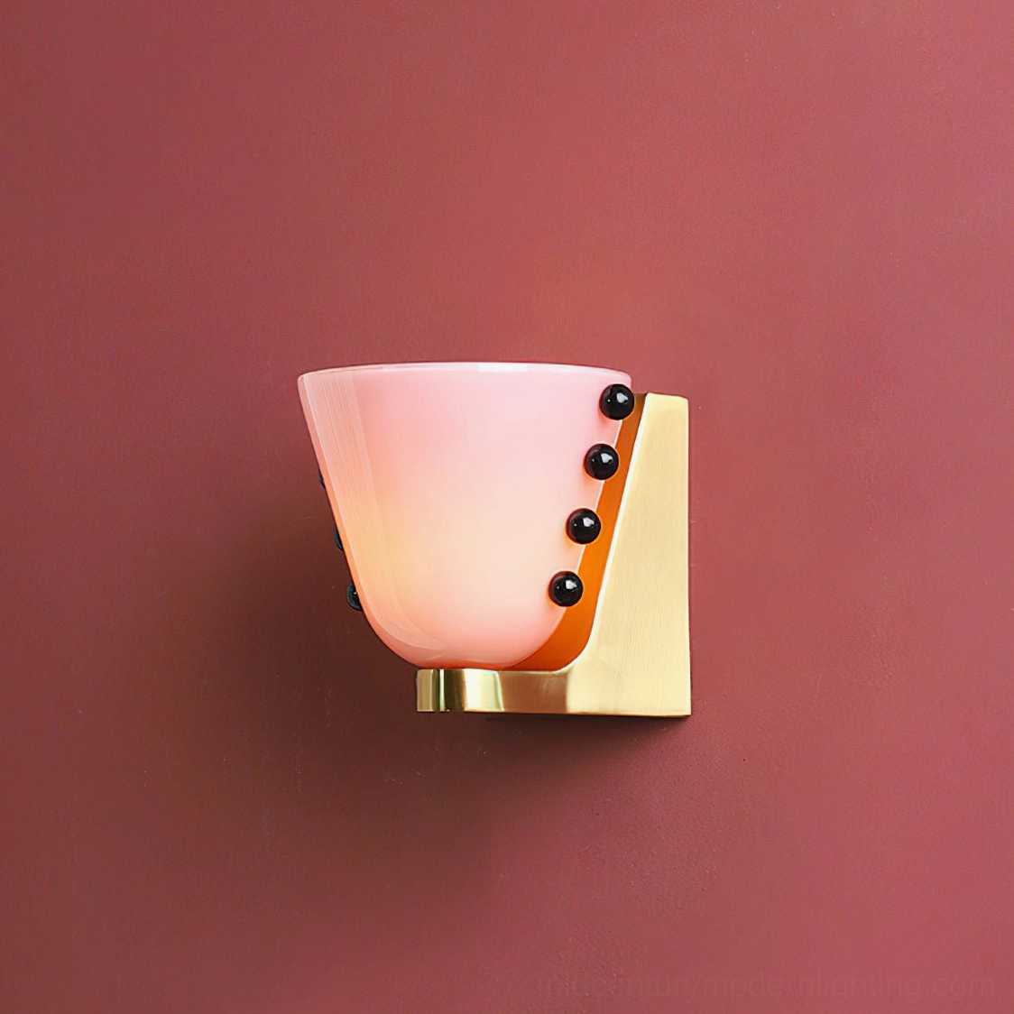 Berries wall sconce mounted in interior living space demonstrating design integration and ambient lighting effect