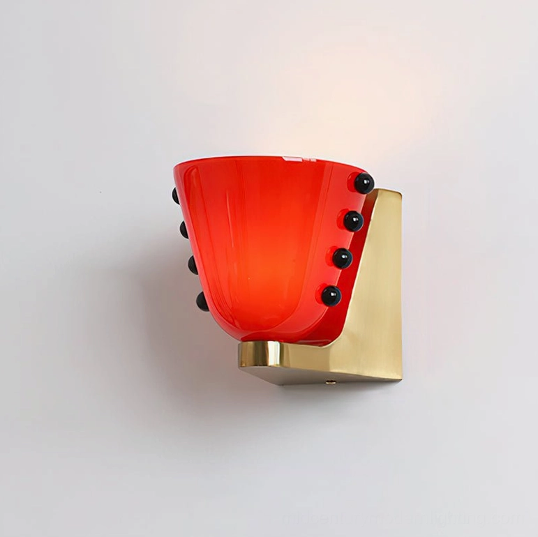 Berries wall sconce in vibrant red and gold colorway with premium brass-finished metal components
