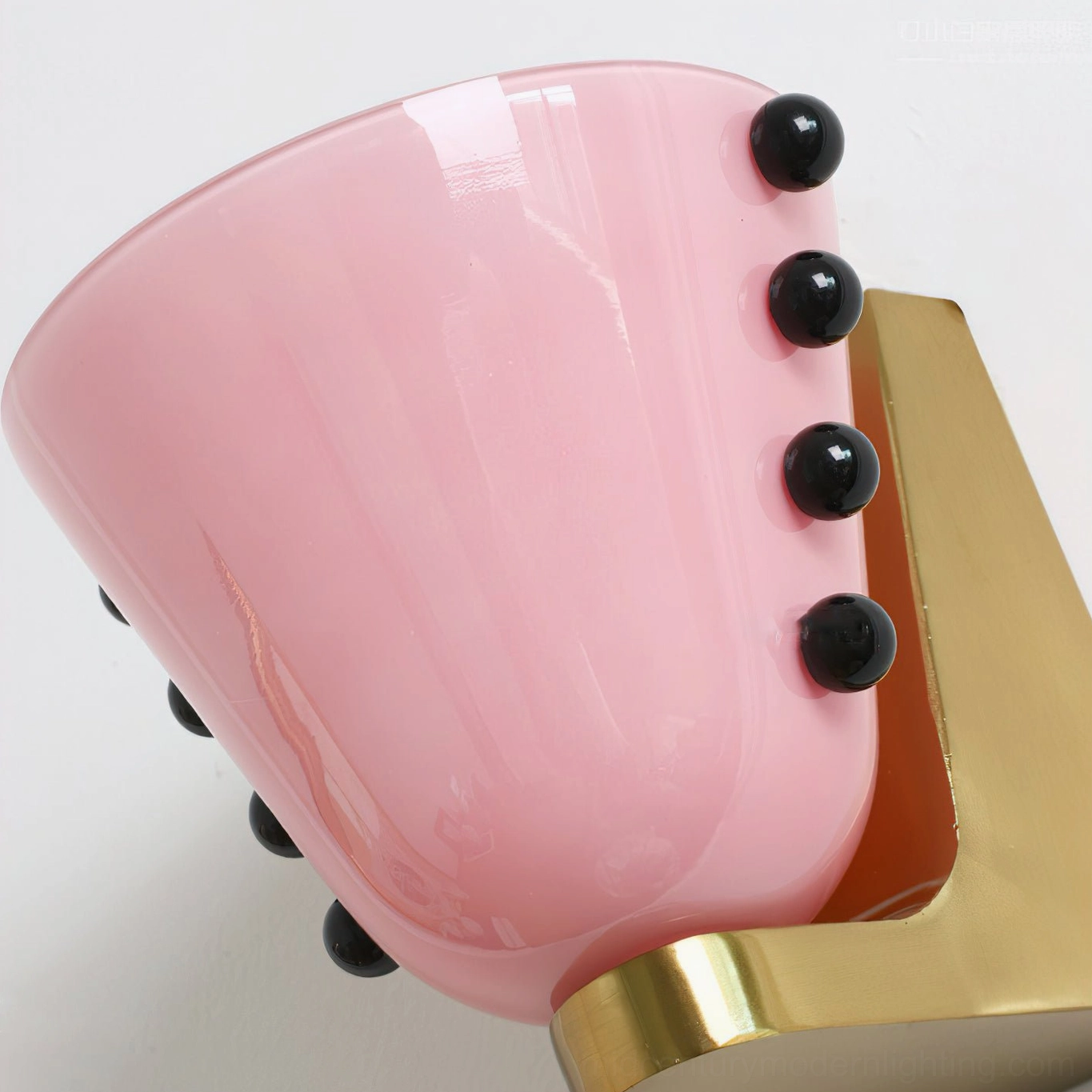 Berries wall sconce in white and gold finish displayed against neutral background, mid-century modern design aesthetic