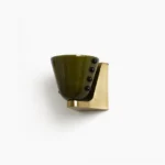 Berries wall sconce with dark olive green hand-blown glass shade, brass gold base, and black bead vertical accents in studio flat view