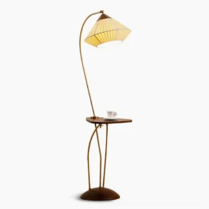 Bertil mid-century modern arc floor lamp with attached walnut side table, brass gold frame, pleated beige fabric shade, studio view
