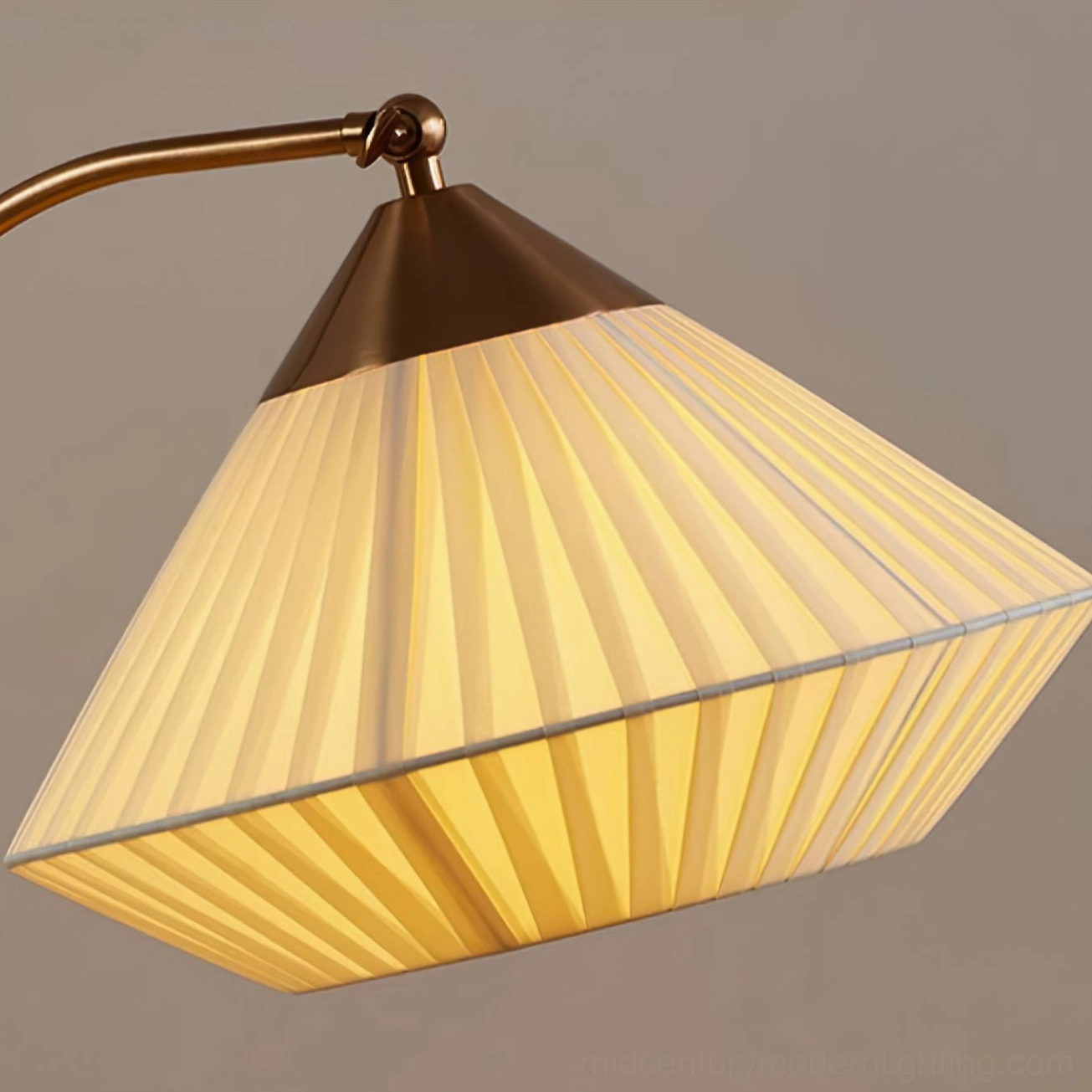 Bertil illuminated pleated shade, soft warm glowing light diffusion, tapered conical beige fabric with brass trim detail