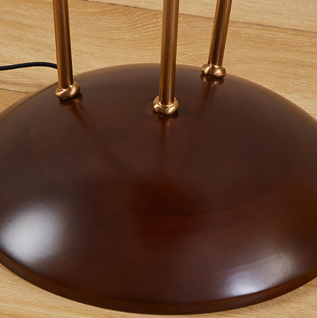 Bertil floor lamp base detail, polished dark walnut wood base with brass gold metal joints and hardware close-up