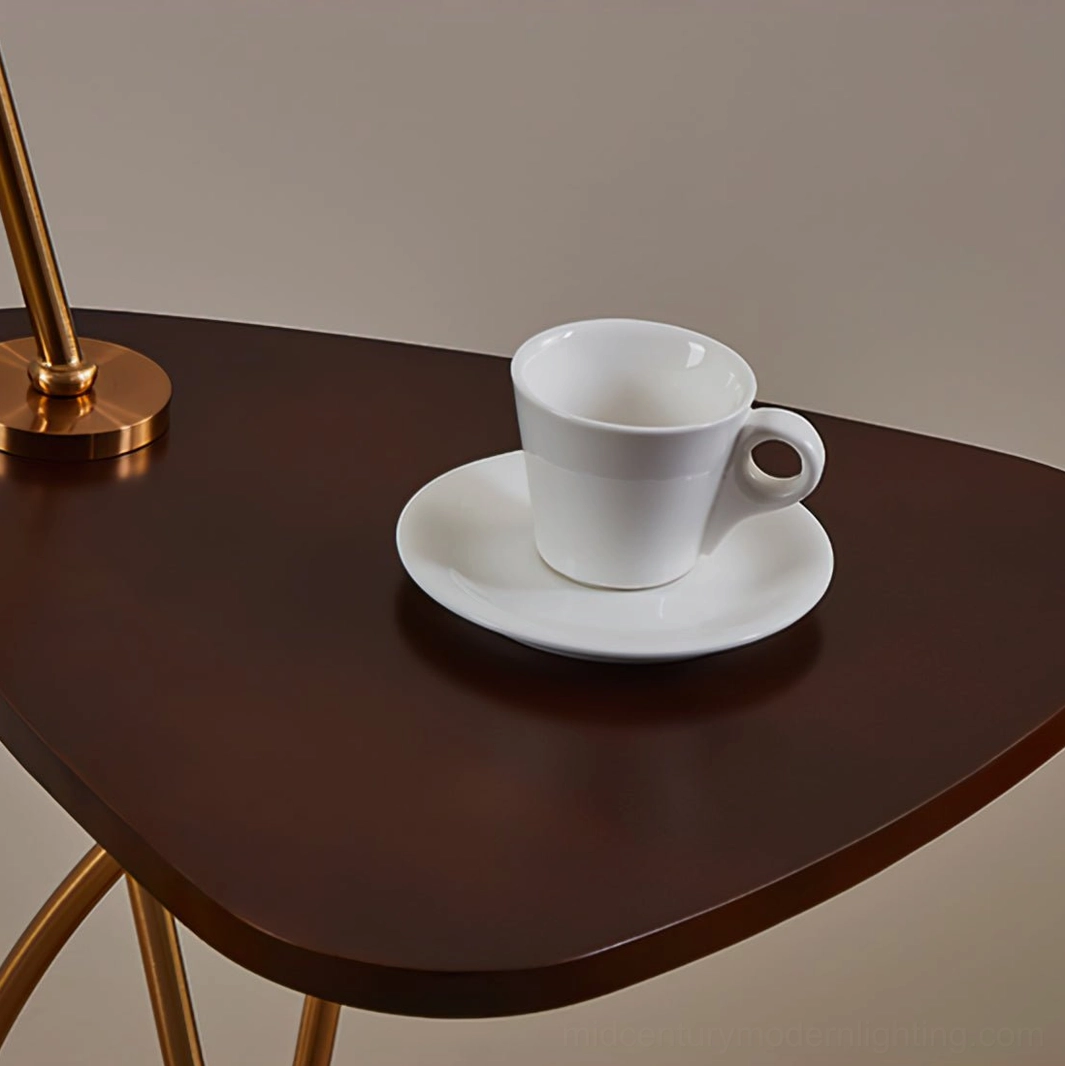 Bertil arc lamp side table detail, dark walnut tray with coffee cup and white saucer, integrated side table functionality