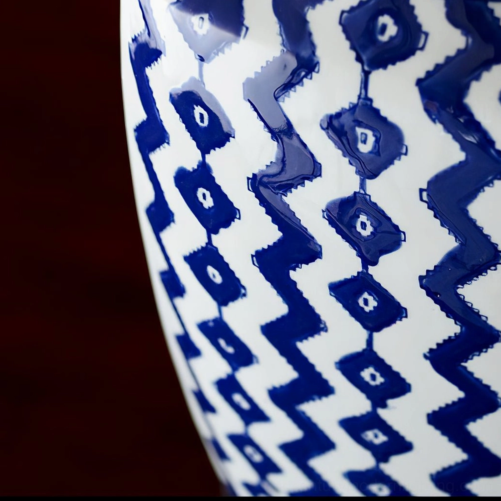 Close-up macro detail of Beryl ceramic base with glossy navy and white chevron textured glaze finish