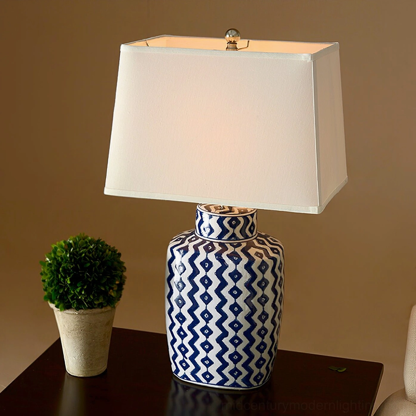 Beryl mid-century modern table lamp with blue and white porcelain base and satin nickel hardware details