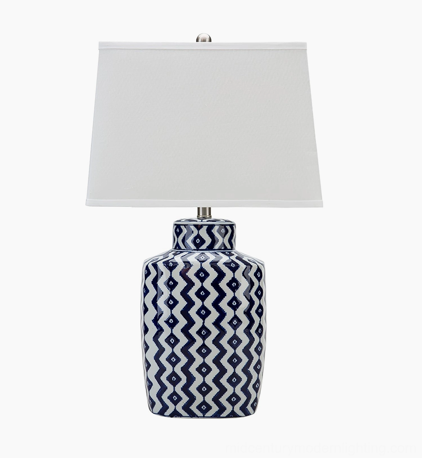 Beryl table lamp with solid white tapered fabric shade and geometric blue-white ceramic base on isolated white background