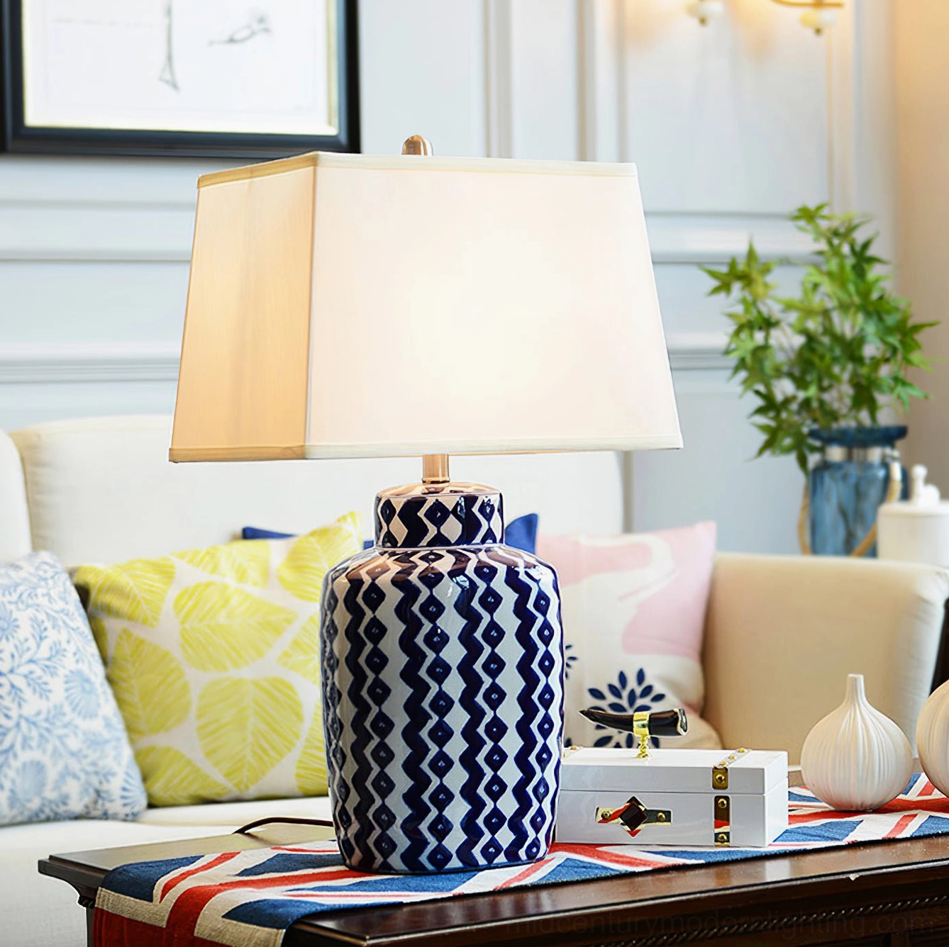 Beryl decorative table lamp in cozy living room with warm traditional style and blue-white geometric ceramic design
