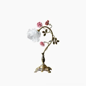Beulah rose table lamp with twisted brass stem and ceramic floral details on white background, front view