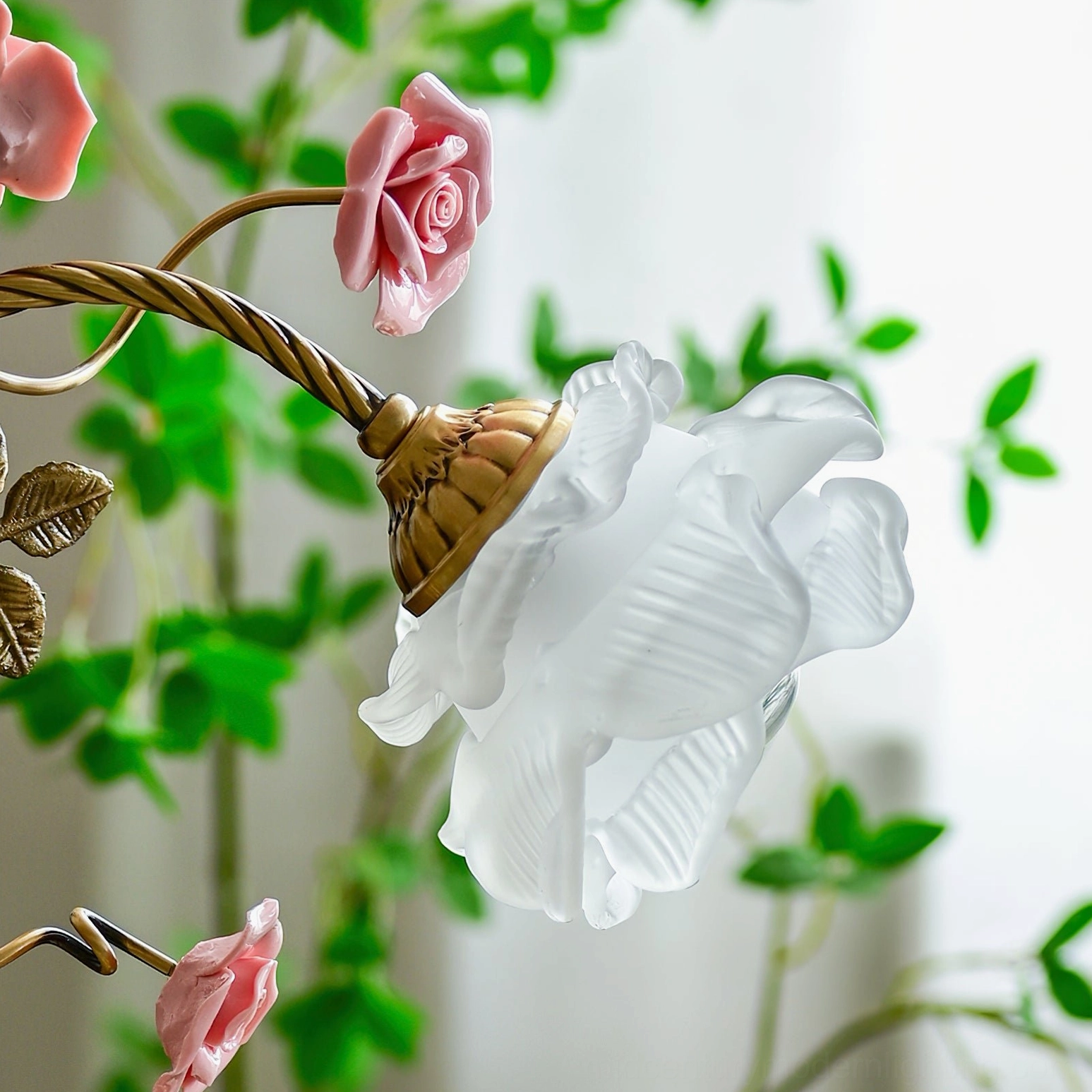 Beulah botanical brass table lamp detail shot showing twisted stem and ceramic flower accents