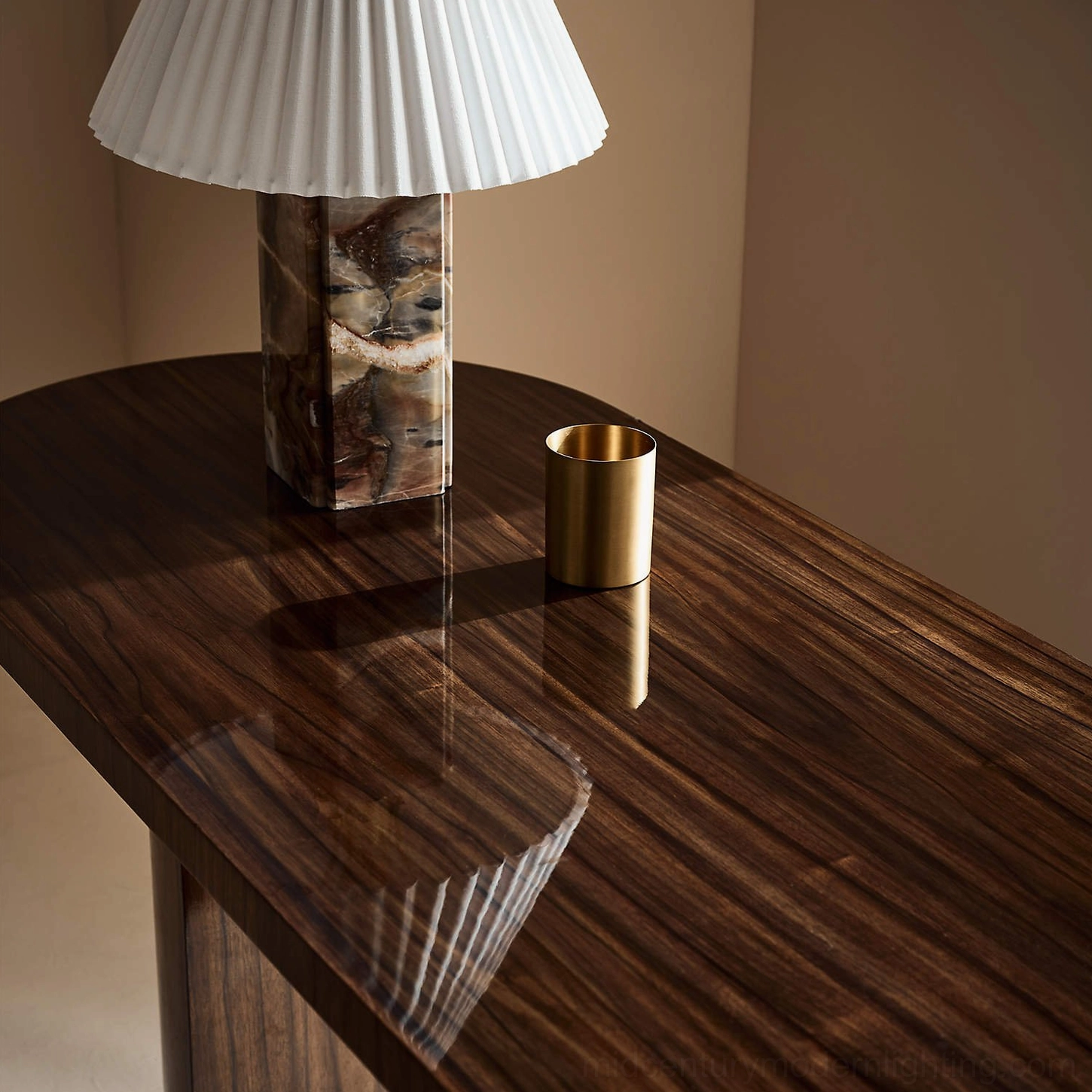 Bianca marble table lamp on polished wooden tabletop with brass gold decor accents