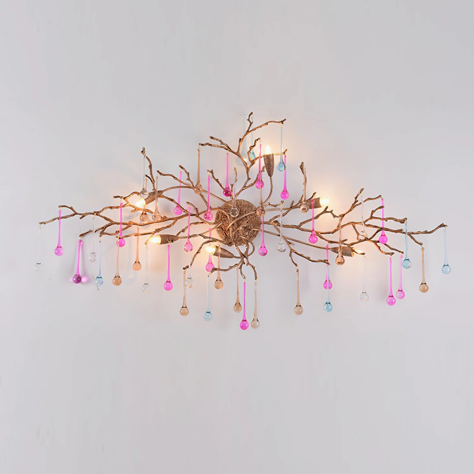 Bijout wall lamp with pink and blue glass droplets fully illuminated studio view