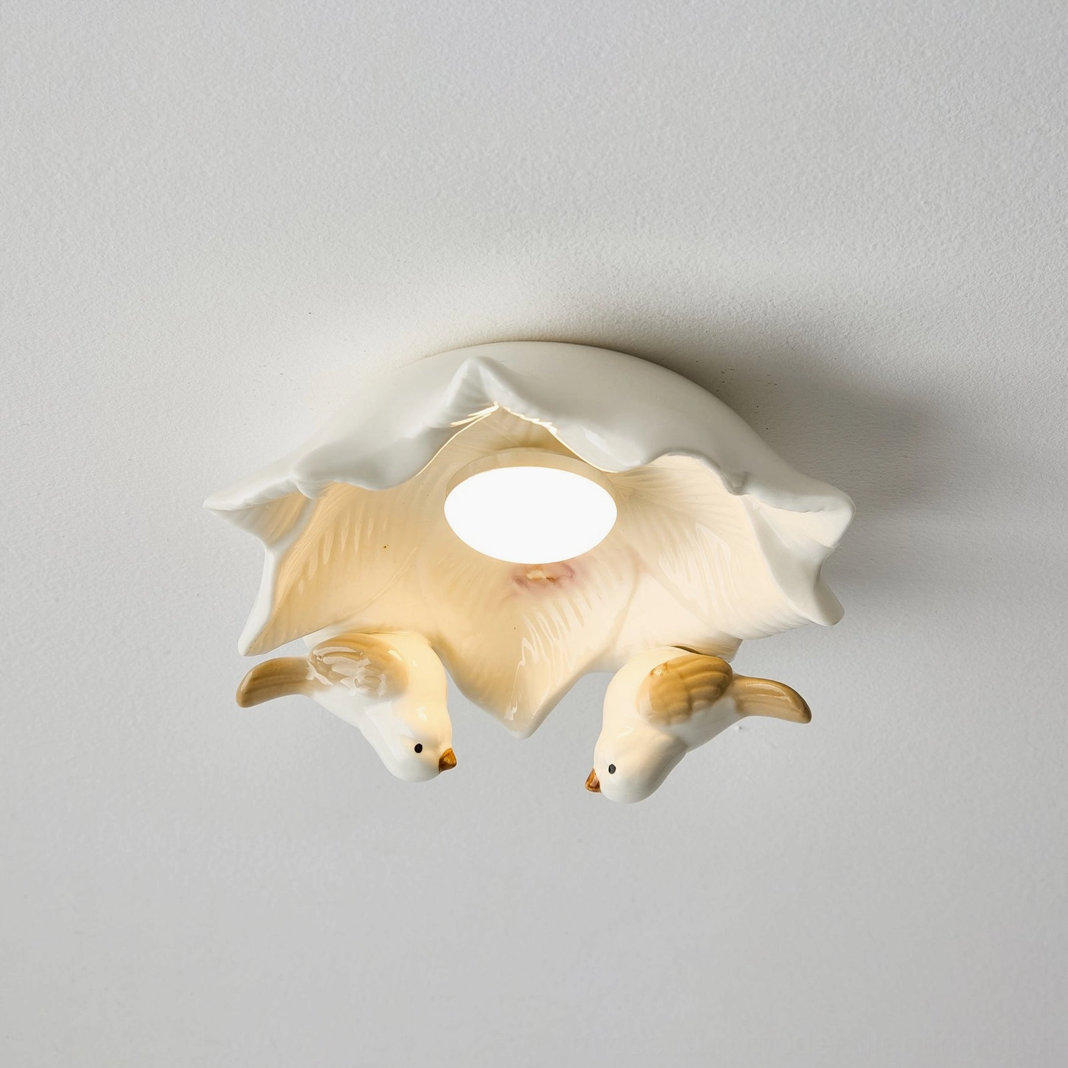Bilal Bird sculptural ceramic ceiling light fixture showcasing pastoral aesthetic and handcrafted bird figurines