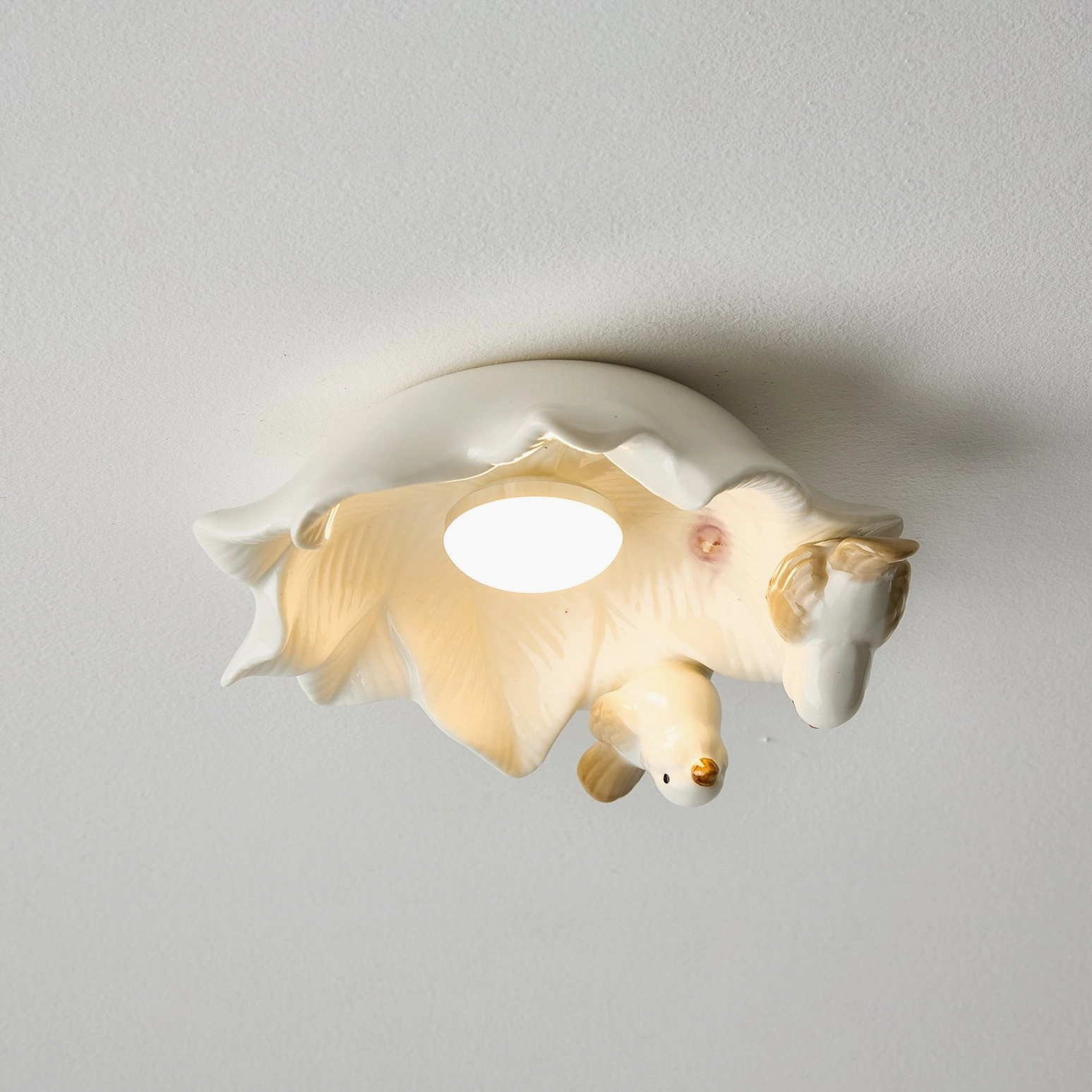 Bilal Bird bird-themed ceramic ceiling fixture detail showing artistic bird placement and light diffuser structure