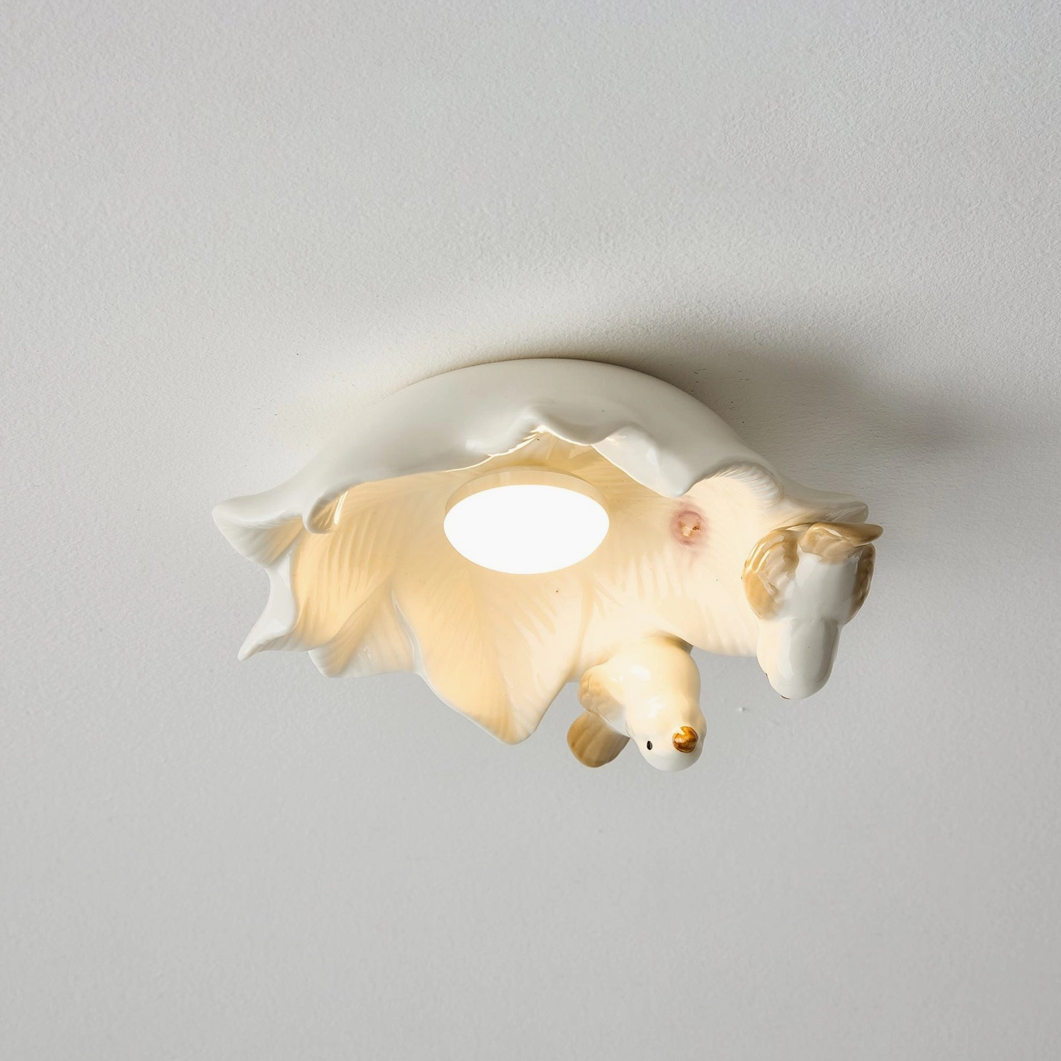 Bilal Bird ceiling light close-up highlighting off-white matte ceramic finish and naturalistic bird proportions