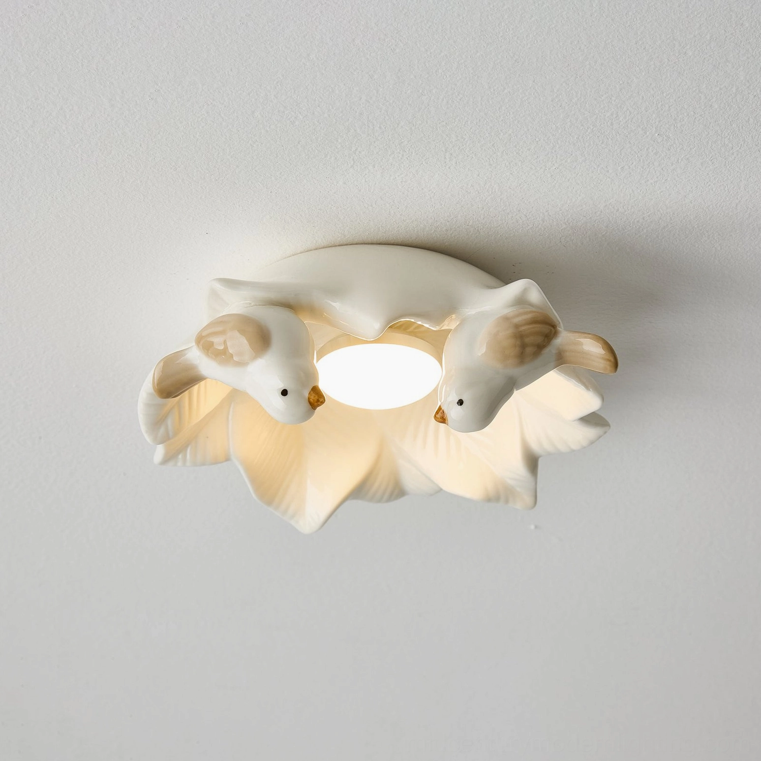 Bilal Bird nature-inspired ceramic ceiling light showing intricate bird figurines and sculptural base design